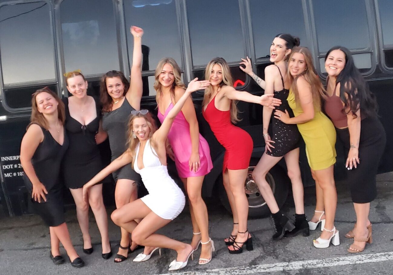 A group of women posing for the camera.