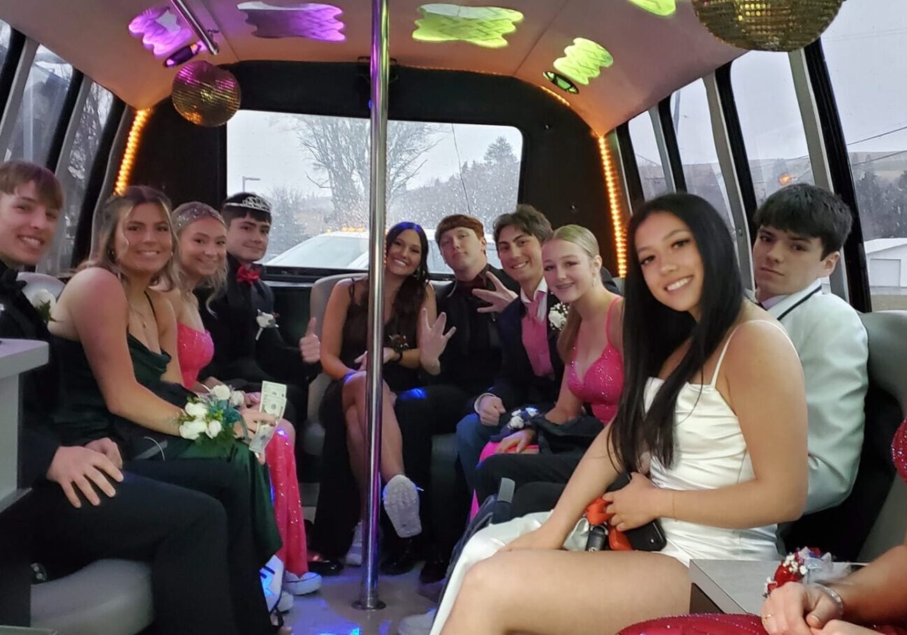 A group of people in the back of a limo.